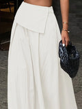 Witte asymmetrische maxi-rok met omslagtaille en knopen